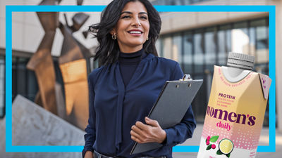 Woman with document holder, protein drink in Tetra Prisma Aseptic carton package