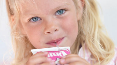 Girl drinking milk, Tetra Fino Aseptic carton