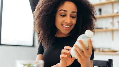 Girl holding milk bottle