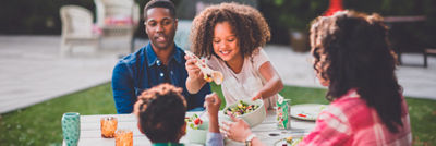 A Family eating outdoors