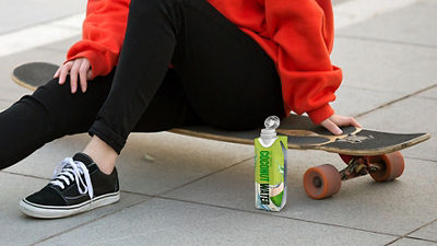 woman on skateboard and coconut