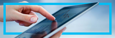 finger pointing at data on tablet