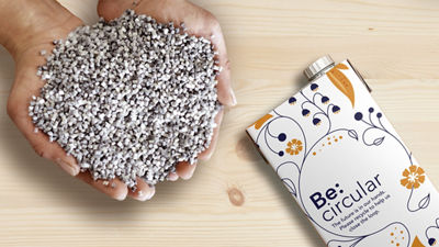 Hand holding polymers and a cartton package