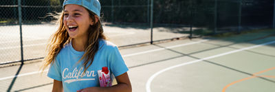 Sporty girl with a nutrition drink.