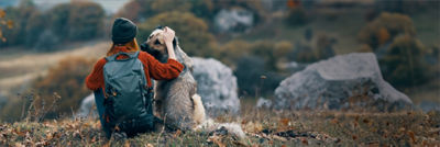 Woman and her dog hiking