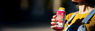 Holding protein drink in Tetra Top carton package bottle