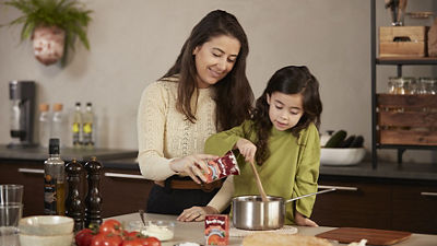 mother and daughter cooking