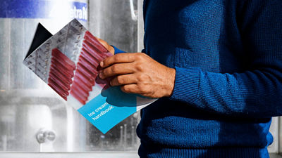 person reading the ice cream handbook