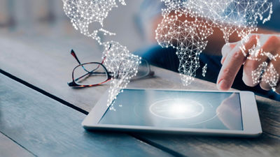 Ipad on table with world map