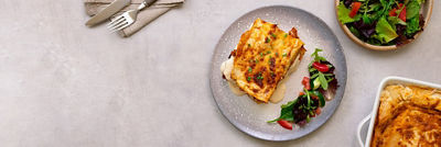 lasagna with salad on a table