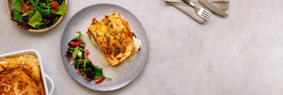 lasange with vegetables on a table