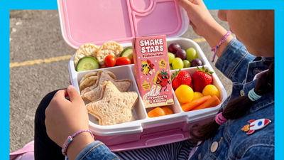 Lunch box with shake stars drink, sandwich, fruits and vegetables