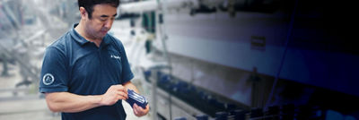 Man looking at spare part