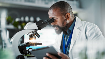 Man looking in microscope