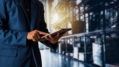 Man in warehouse with tablet