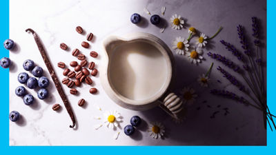 Milk in jug, blueberris, vanilla bean  and coffee beans