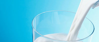 Milk pouring into glass