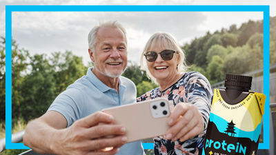 Older couple with mobilephone and nutrition drink.