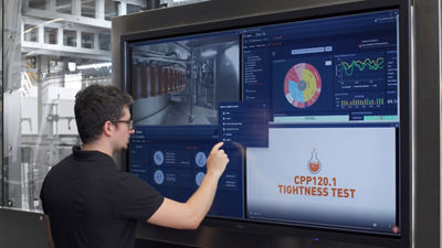 Operator using Qual-IS™, a quality control system for aseptic production