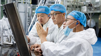 Opertors in protective clothing