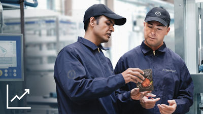 Operators looking at a Tetra Recart package