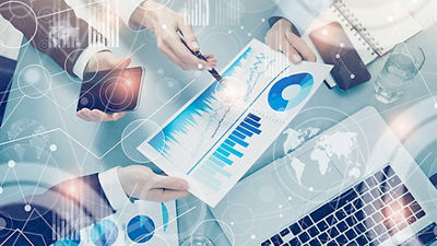 People analysing and discussing reports