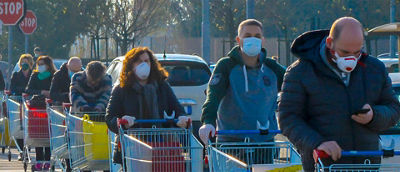 People with face masks standing in line