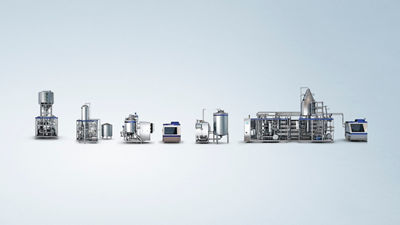 Range of industrial processing equipment for plant-based beverage production displayed against a light blue background.