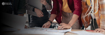 Printouts with graphs and data on table