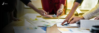 Printouts with graphs and data on table