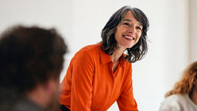 Woman participating in business meeting discussion