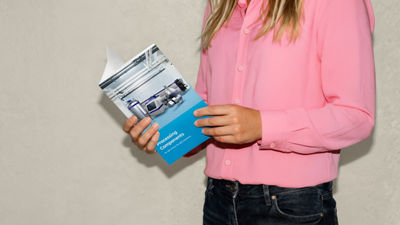 Person holding processing components brochure for food and beverage production