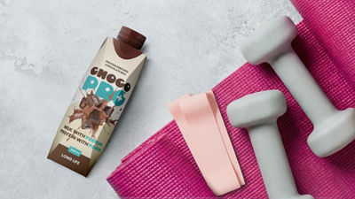 protein shake next to a yoga mat 