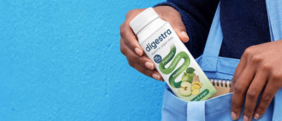 Putting probiotic yoghurt drink in Tetra Top carton in handbag