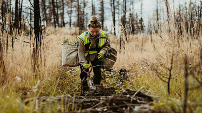 woman in field with spade