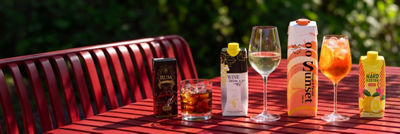 Spirits, wine, and RTD alcoholic beverages in carton on a table