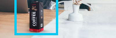 Coffee concentrate in Tetra Classic Aseptic carton on table, blue frame