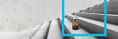 Coffee in Tetra Top carton standing on the stairs, blue frame