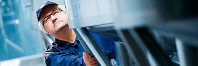 Service man observing machine