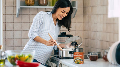 Woman cooking soup