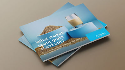 Spent grain guide on table