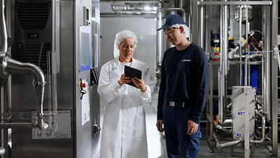 Two collegues in a factory