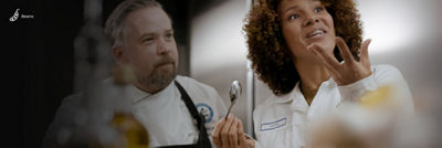 Chef and customer testing food at the Food development centre