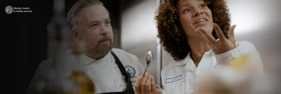 Chef and customer testing food at the Food development centre