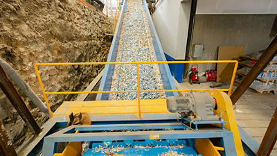Machinery system for processing and recycling paper cartons.