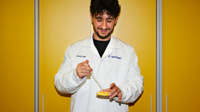 Tetra Pak Food Lab employee examining a food sample in a laboratory