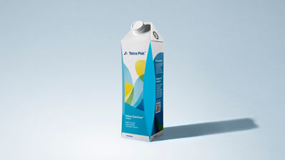 Tetra Pak Tetra Gemina Aseptic 1-liter carton with a white screw cap and colorful blue, green and yellow packaging design against a light blue background.