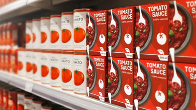 Cans and Tetra Recart cartons with tomato products on shelf