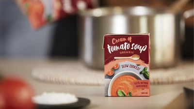 mushroom soup in a white bowl and bred on the side. 