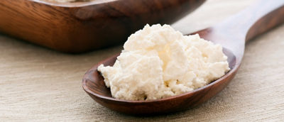 Tvarog cheese on a spoon